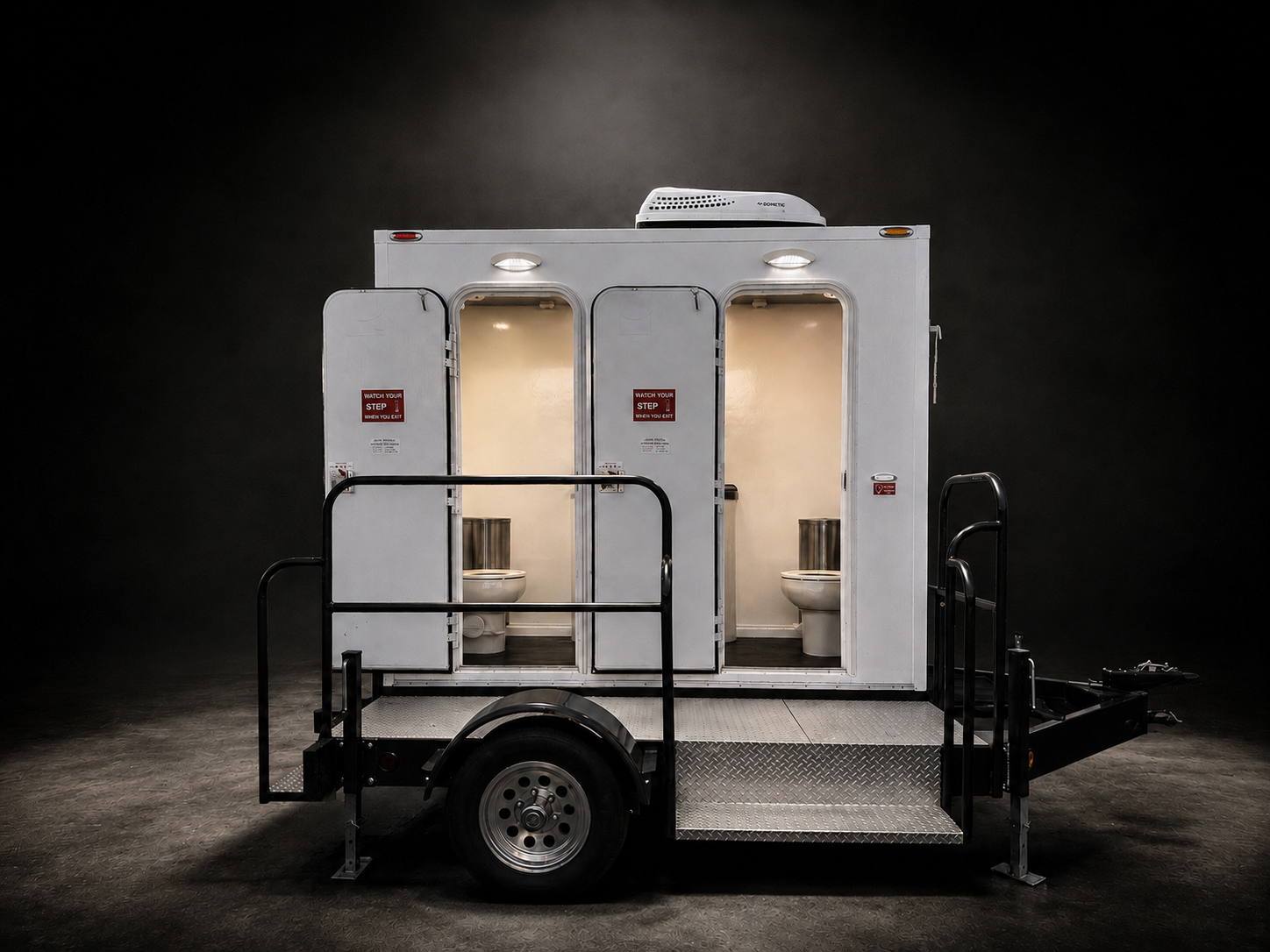 The white Restroom at Santee two-restroom trailer parked on 11th Street